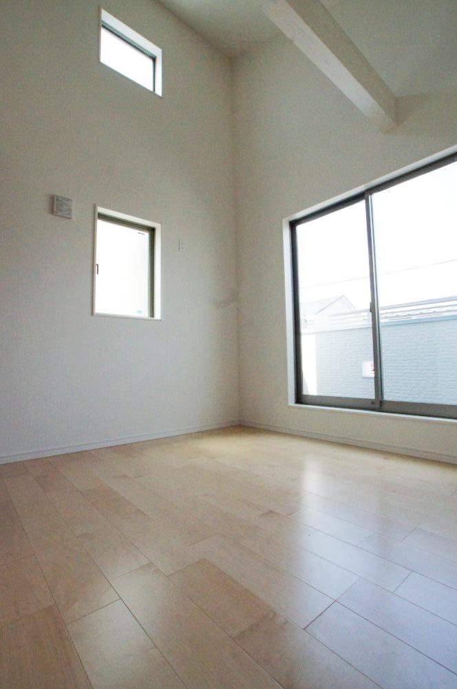 Non-living room. Living room with a vaulted ceiling is there is a sense of openness