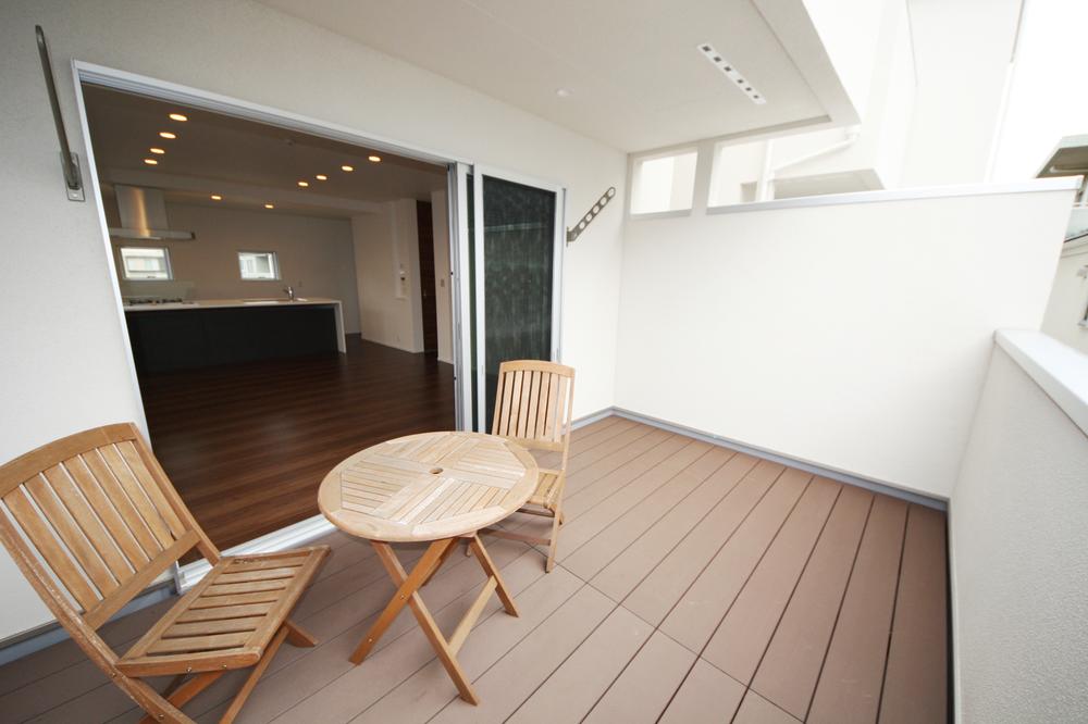 Living. Wood deck balcony (A Building)