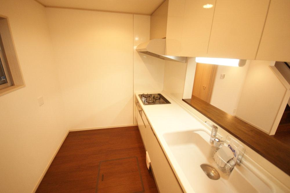 Kitchen. There is a dishwasher and under-floor storage.