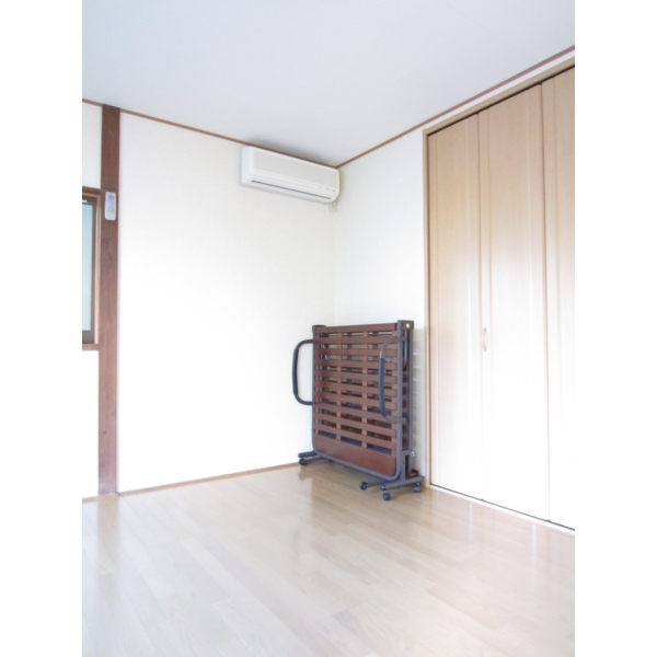 Living and room. There bet leaning against. 