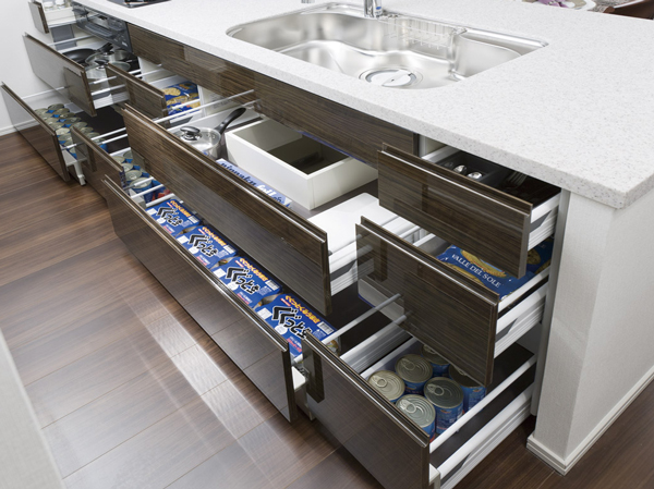 Kitchen.  [Sliding storage] Storage of system kitchens, It can be effectively utilized in the prone cabinet in a dead space, It has adopted a sliding storage.