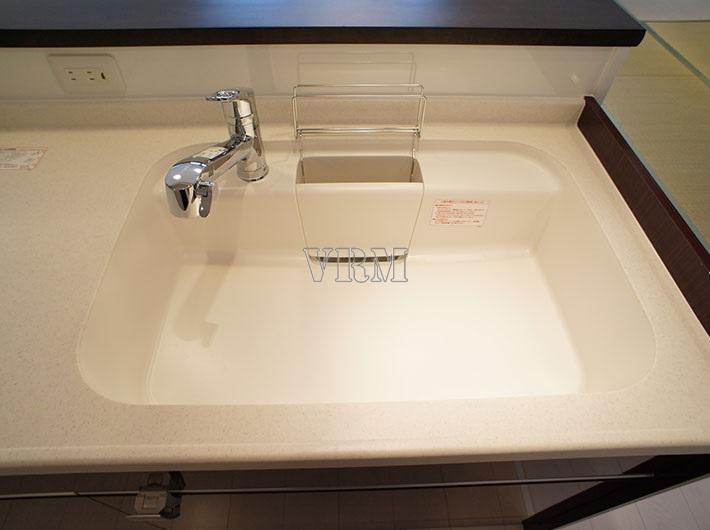 Kitchen. Large sink of artificial marble top