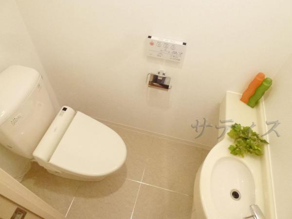 Toilet. Multi-functional toilet with even hand-washing facilities