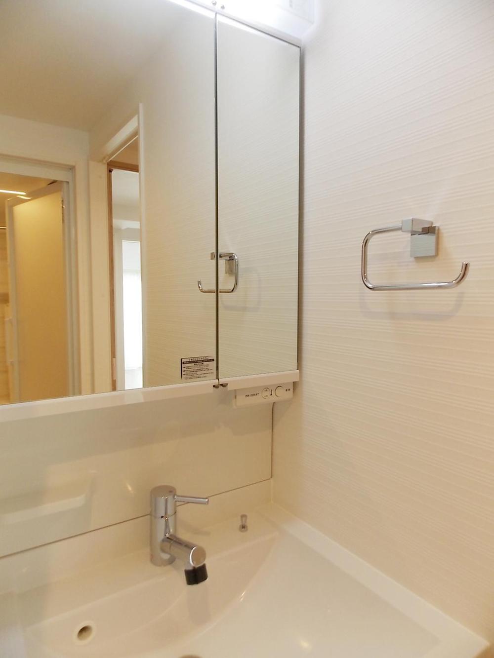 Wash basin, toilet. There is a spacious space also wash room.