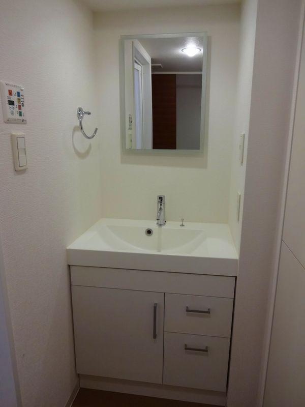 Wash basin, toilet. Bathroom vanity