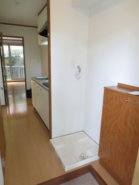 Living and room. Happy indoor washing machine Storage. There is also a cupboard.