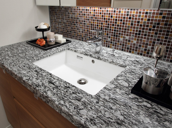 Bathing-wash room. Wash bowl of natural stone counter