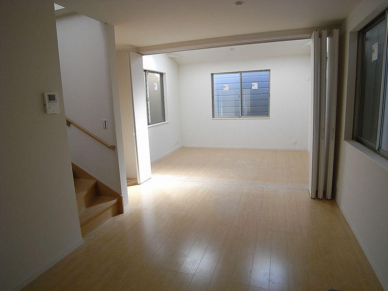 Living. Living the entire photo, Stairs you will see. 