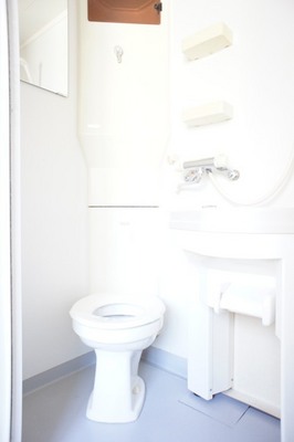 Toilet. Washbasin movable, Storage rack, There is also a mirror