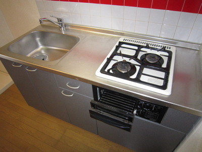 Kitchen. Two-burner gas stove installed base with grill