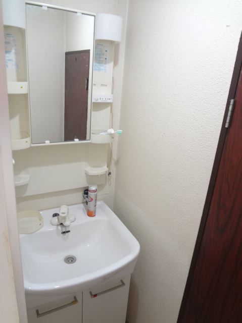 Washroom. Basin shared.