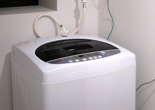 Balcony. Coin-operated washing machine