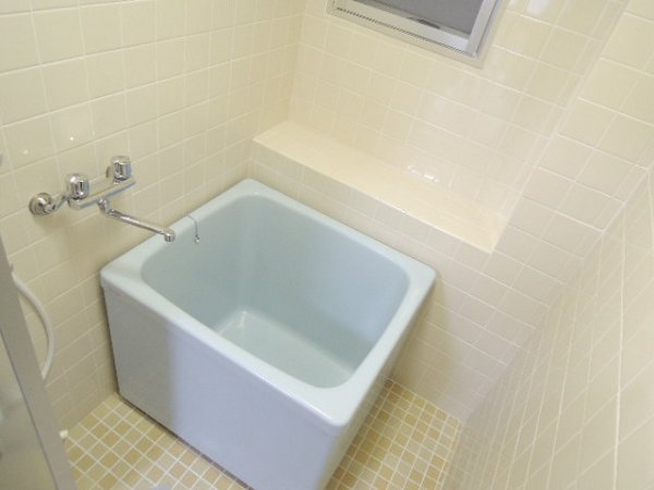 Bath. There is a window in the bathroom