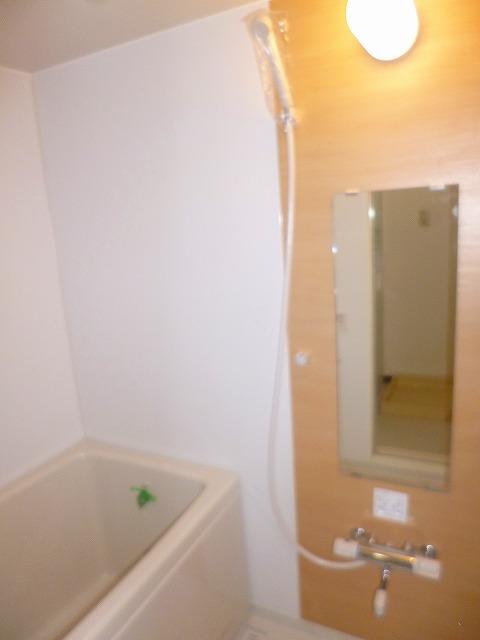 Bathroom. In refreshing impression bathroom, Panel of wood is accented.