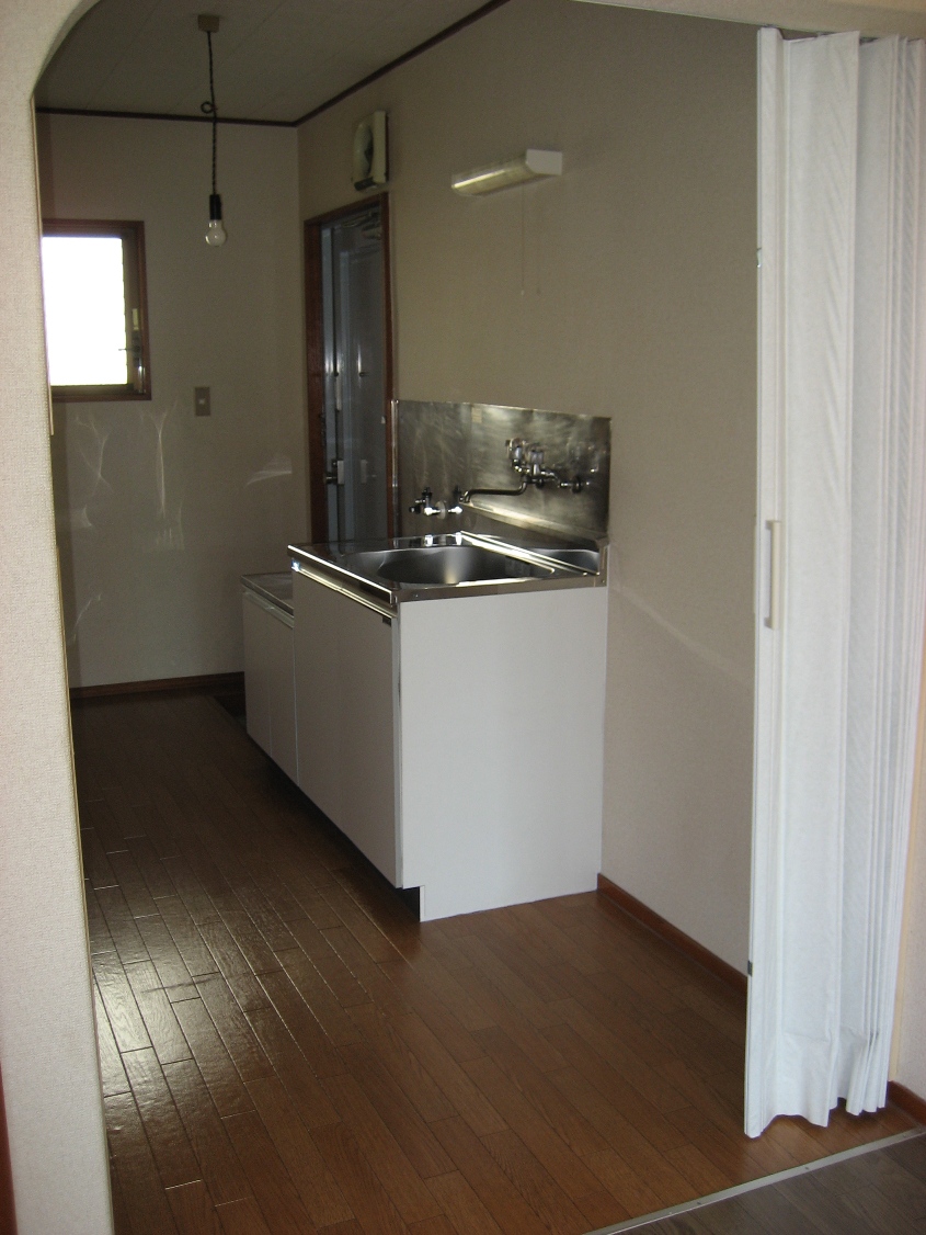 Kitchen. There accordion curtain for partition