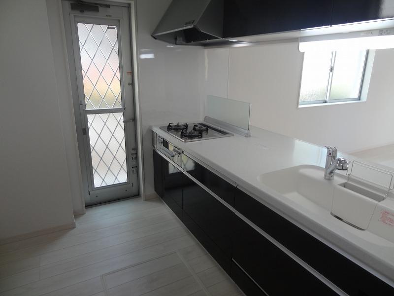 Kitchen. There is a convenient back door kitchen