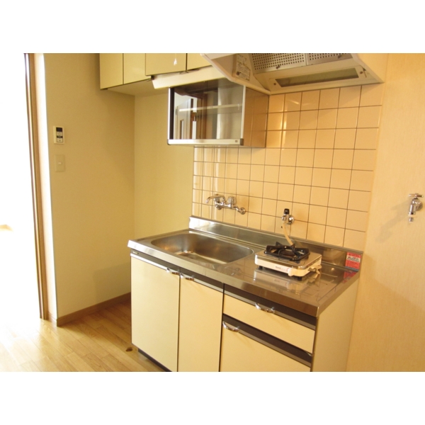 Kitchen. Gas stove installation type of kitchen. Storage enhancement, such as upper receiving.