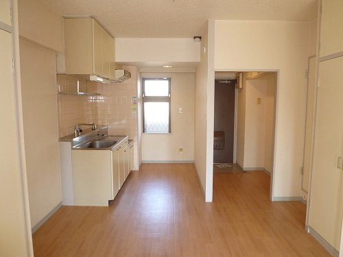 Living and room. There is a window in the kitchen