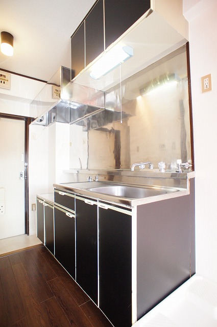 Other room space. Kitchen panel is a chic sense of black