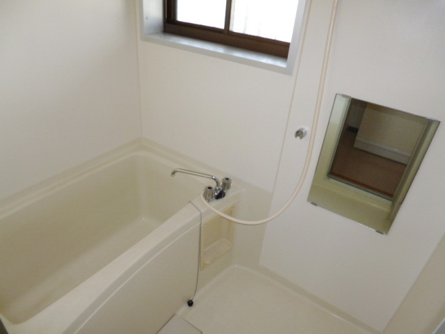 Bath. There is a window in the bath