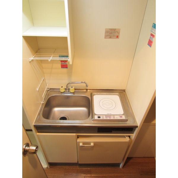 Other Equipment. Compact kitchen with a mini fridge