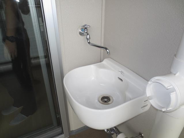 Balcony. Slop sink which is installed on the balcony.