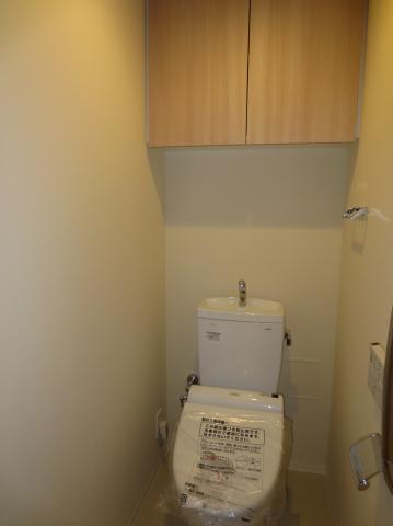 Toilet. Toilet, It is with a cleaning function. Also it comes with a hanging cupboard.