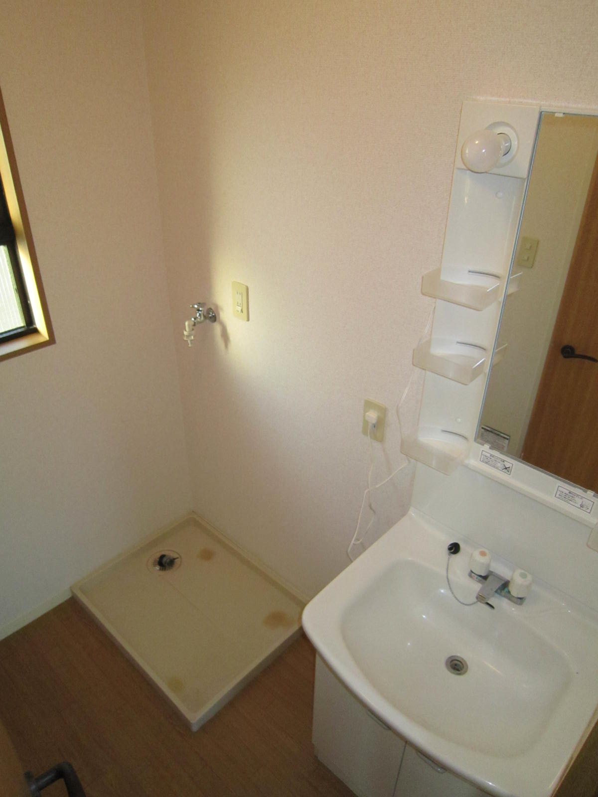 Washroom. There waterproof bread with Washing machine in the room