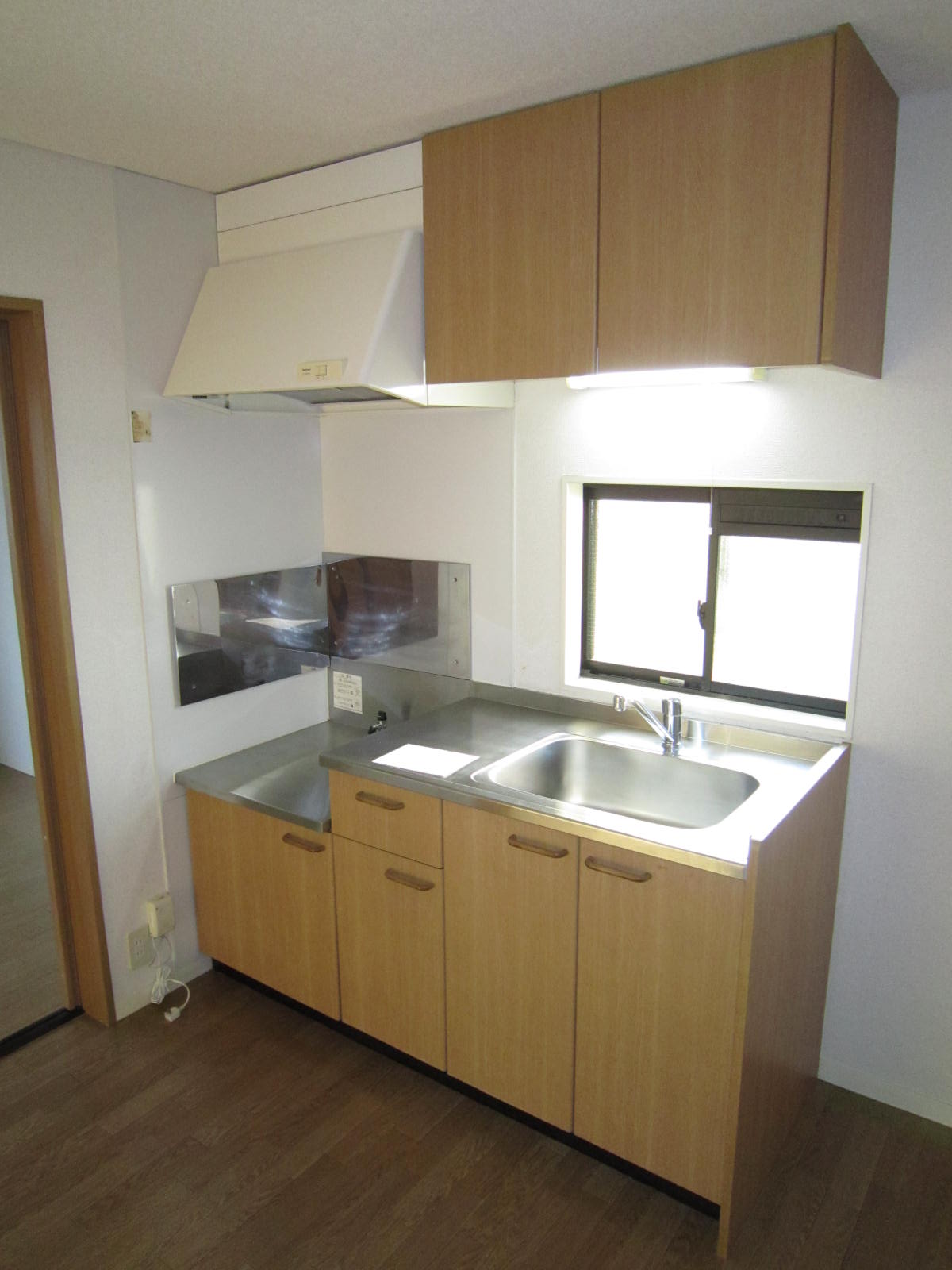 Kitchen. It is around the bright kitchen there is a window