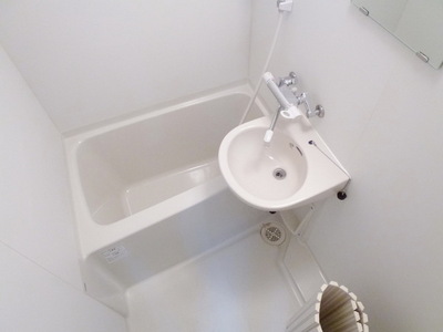 Bath. It is a bathroom with cleanliness