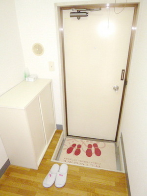 Entrance. There is also a shoe rack