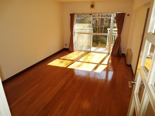 Living. (Living) because it is the south side of the living room with plenty of sunlight from the large windows is a bright room with shine in.