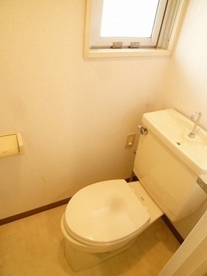 Toilet. There is a window in the toilet