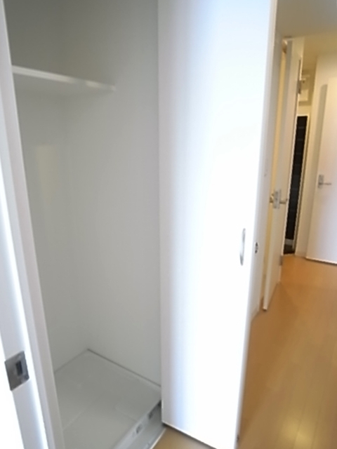 Other Equipment. Washing machine in the room is equipped with door.