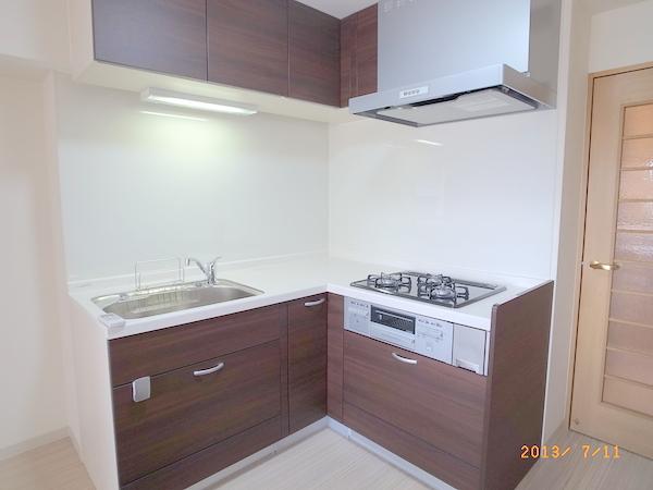 Kitchen. The apartment is a reference photograph.