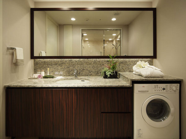 Bathing-wash room.  [Powder Room] Powder room using luxury natural stone. luxury ・ Exclusive ・ In exclusive suites, Konasu from clothing of washing up to dry by a single, It has established a fully automatic washing dryer.  ※ In the apartment gallery, Powder room of the equipment can be confirmed. (The room is different from the one of this sale)