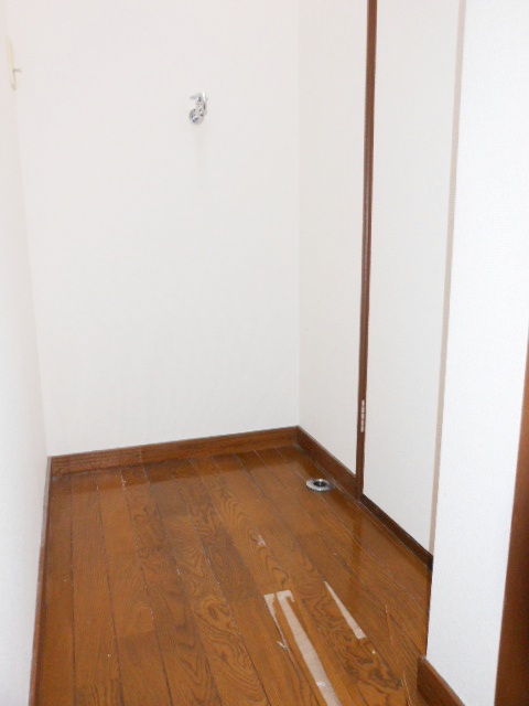 Washroom. Washing machine in the room