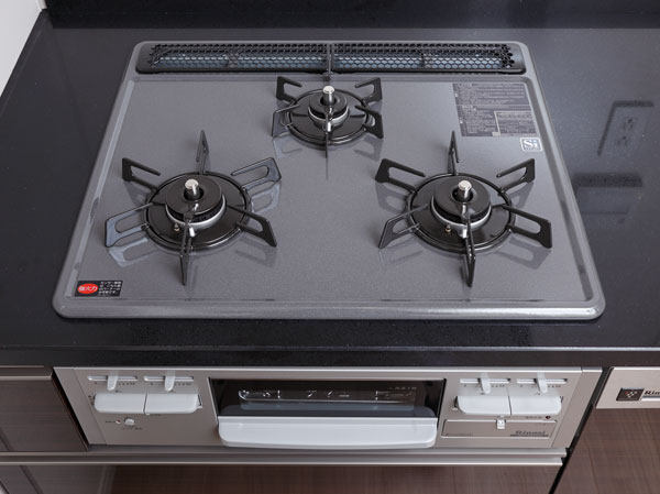 Kitchen.  [Enamel top stove] Adopt an easy three-necked enamel top stove to clean. Is easy to clean just wipe a quick.