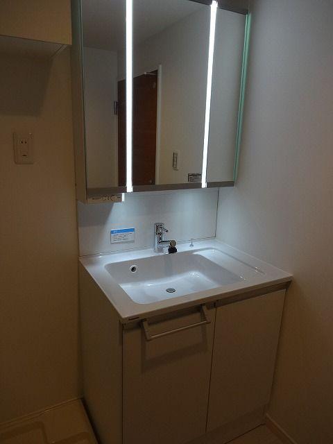 Wash basin, toilet. Bathroom vanity