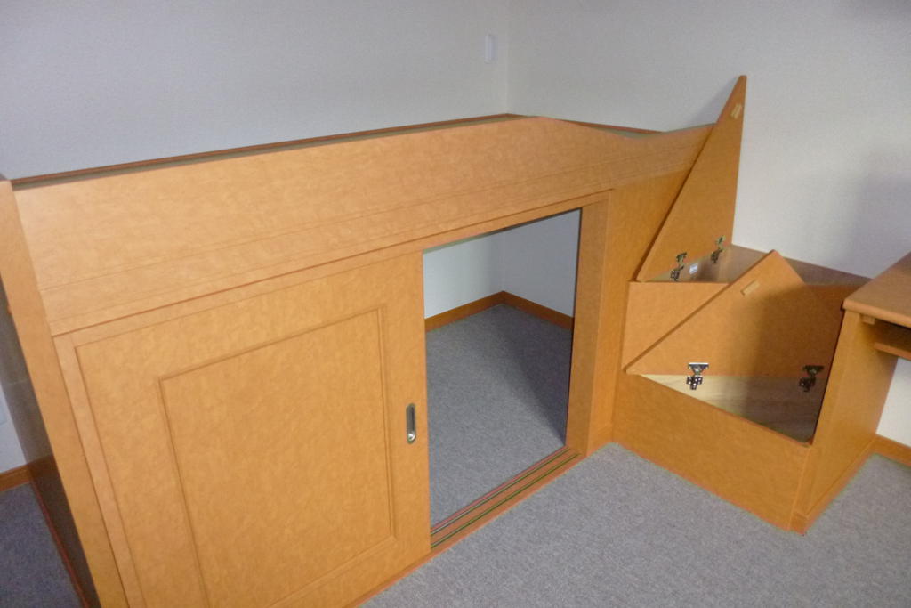 Other. Housed under the single bed, There is housed in the stairs part.