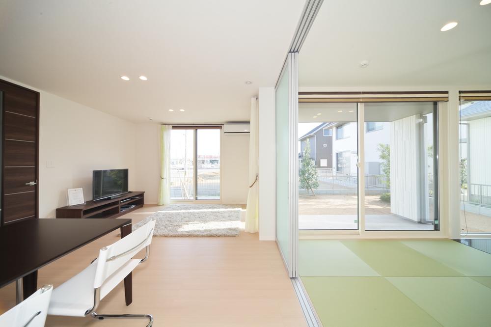 Living. It is a bright room with large opening