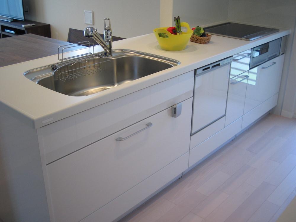 Kitchen. It is clean pat white kitchen