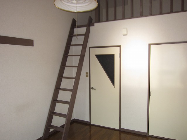 Living and room. There are stairs to the loft!