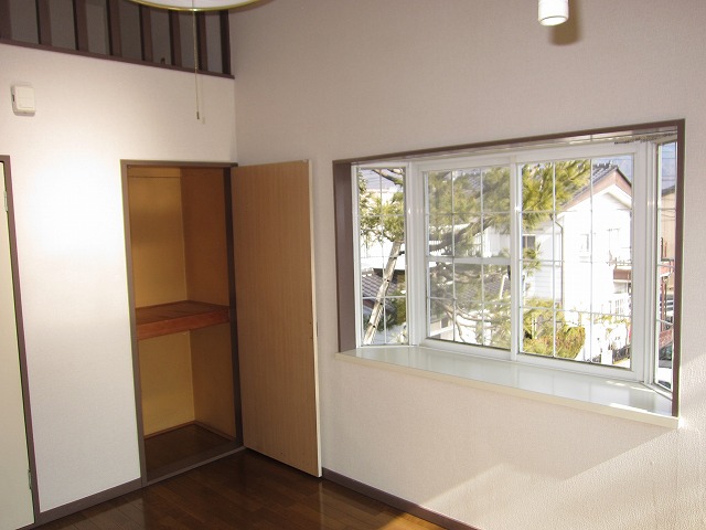 Living and room. There is also a bright storage there is a bay window!